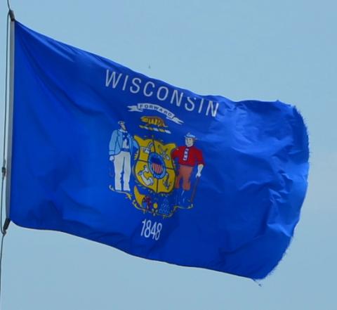 Wisconsin state flag Wisconsin state flag flying in the breeze